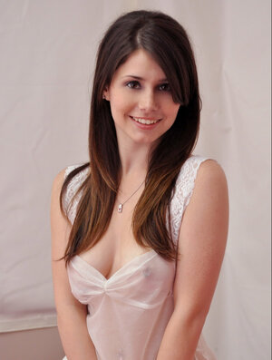 Young and fresh beautiful thing removes transparent dress to display fine perky boobs