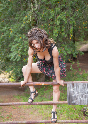 Underweight country gal gets topless to reveal her great big breasts in the woods