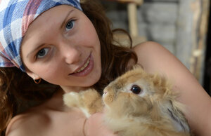 Farmer's playful daughter fools around nude with animals in the barn