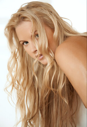 Sexy towheaded sweetheart gets completely all naked and seduces with her precious body