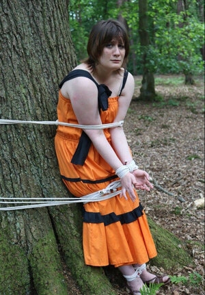 Helpless housewife is captured by lover and besides pinioned up to tree in public park