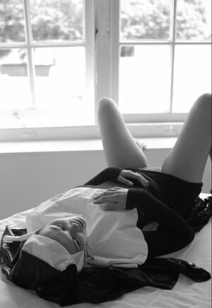 Immoral nun reveals tits while spreading legs to wank her cunny