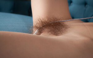 Dazzling brawny hottie spreads legs to reveal her extremely-hairy muff
