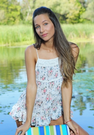 Underweight chick doesn't hesitate to pose undressed in fresh air near river