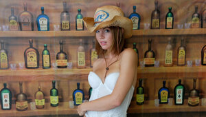 Performer by the name of Diddylicious wears a straw hat in the sexy individual gallery