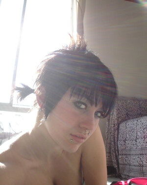 Student with a nose ring is so hot that she goes crazy about her own body