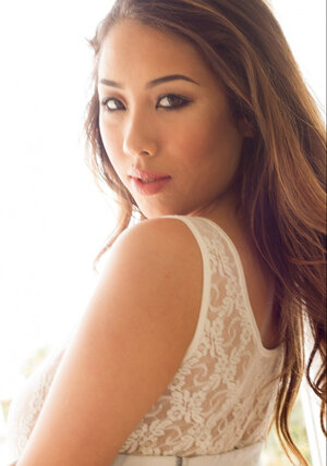 Unforgettable Asian lassie doesn't want white lace bodysuit to hide her huge breasts