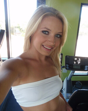 Lovely blonde cutie pie teases by undressing and running into her tempting curves