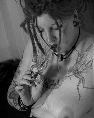 Babe with fuzzy hair reads a magazine and furthermore masturbates in black and furthermore white