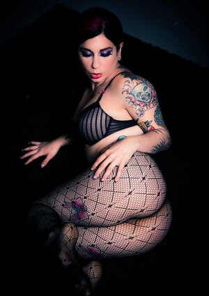 Big-breasted brunette illuminates a dark room with her naked boobs and moreover tushy