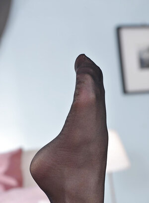 Steamy lady licks her own feet with pantyhose on and without them