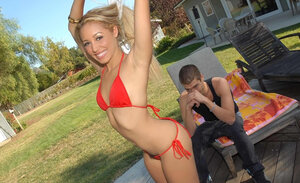 Flaunting her first-class body in a bikini trying to get him hard