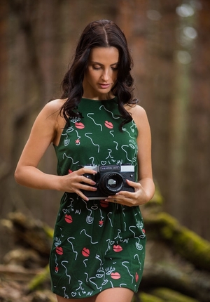 Long-legged Ukrainian bombshell poses nude in the mysterious coniferous forest