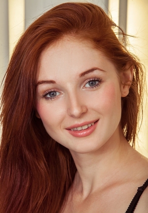 Red-haired sexpot Leona Honey not shy to take clothes off and moreover show her assets