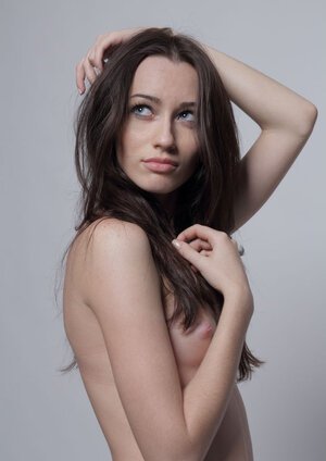 Lean brunette with a glabrous slit is here to showcase herself