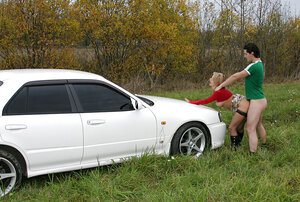 Fancy dame satisfying orally in the backseat prior to hard sex