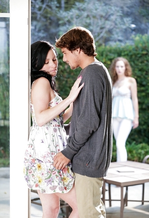 18-19 y.o. girl watches charming brunette snogging with handsome neighbor