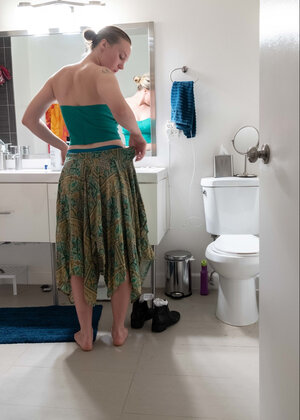 Blonde in a thong shows her backside while transforming quickly