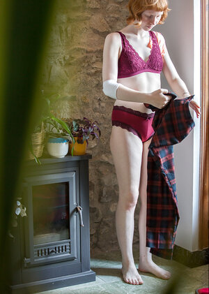 Redheaded hottie puts on her pants and looks extremely, extremely nice