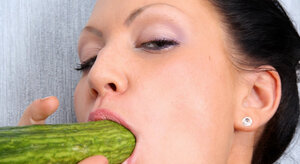 Brunette is going to show what she can do with a cucumber