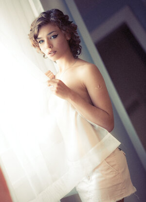 Short haired and plus furthermore curly brunette shows her fine breasts and plus furthermore more