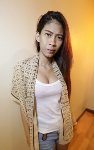 Slim Thai teen shows off her perky jugs and furthermore a shaggy pussy