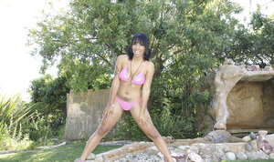 Playful ebony strips down to show off her large bra buddies and bare booty