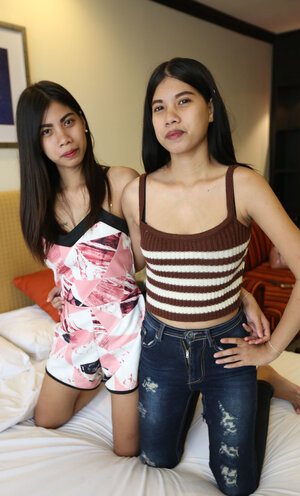 A couple of toteach and ally tight Thai broads get naked to show it each and all