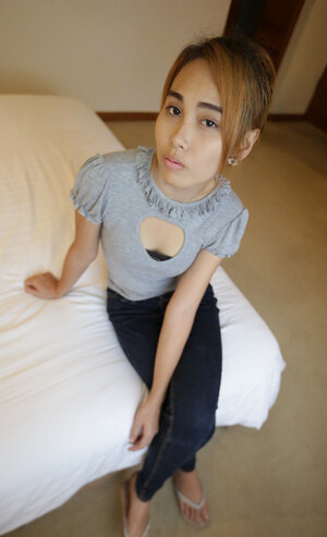 Young and fresh Thai chick shows her natural bra buddies and pretty face