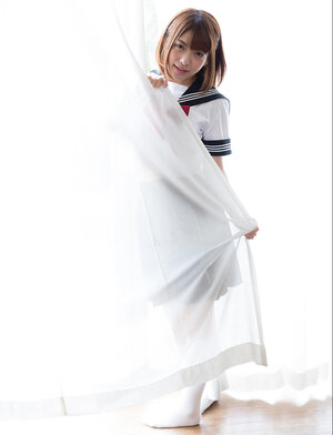 Kawai Japanese schoolgirl shows off her tight bushy pussy