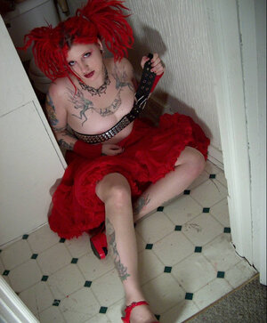 Fetish kitten with flaming red hair spreads her chubby twat wide in the bathroom