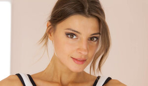 Melena Maria takes a sextoy to her shaved twat on the chair