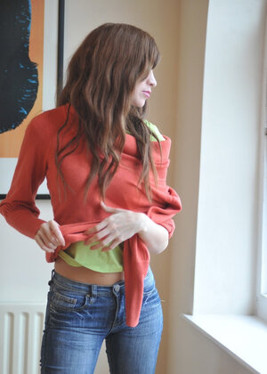 Simone takes off her blue jeans in a non-nude action