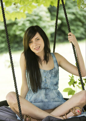 Daniella Rose enjoys her free time in the swing while unclothing