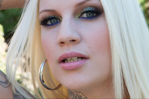 Blonde broad Lucky B Dallas shows off her huge ass wearing fishnet pantyhose