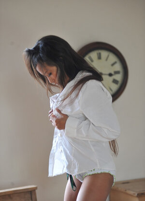 Asiatic glam porn model Ayla Sky reveals her schoolgirl socks and shoes on a school desk