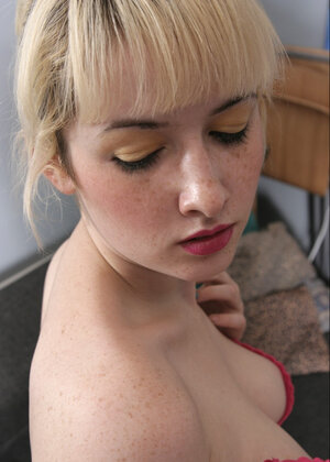 Sexy blonde doll enjoys teasing her puffy snatch and showing off her natural bra buddies