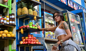 Tattooed Marly Romero licks banana lascivious in public
