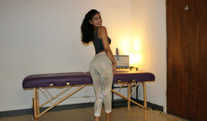 Brunette masseuse gives a handjob with her milk sacks out while topless