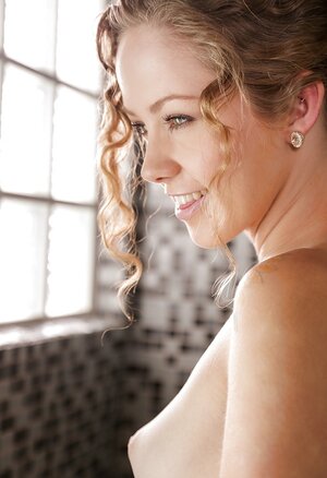 Yoga chick comes to the shower room where willingly poses being naked