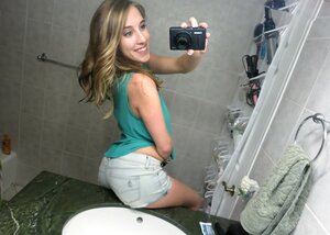 Girl takes provocative selfies in the bathroom and gets banged in the kitchen