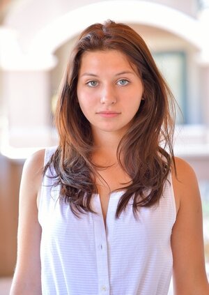 Hot floozy takes white dress down walking the streets bringing boobs to light