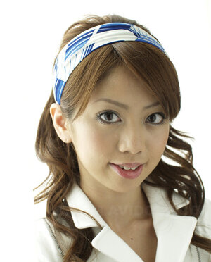 Modest Japanese cutie pie dressed in white dress that accentuates her slimness