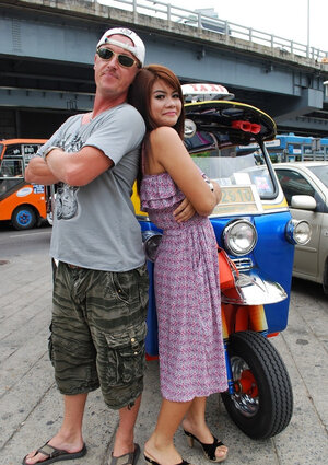 Asiatic teen Tukta with red hair wears sexy violet dress and prefers Tuk Tuk taxi