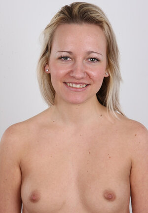 Blonde smiles cuz of shyness getting clothes off item by item in studio