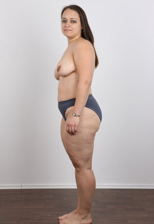 Female turns photoshoot into dirty striptease exposing different-shaped jugs