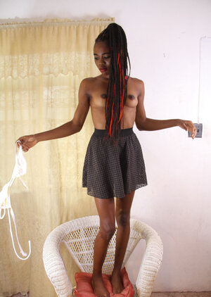 Ebony woman with world-class shapes and dreadlocks gets undressed on camera