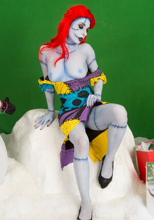 Adult star with fiery red hair looks fuckable even when cosplaying a zombie