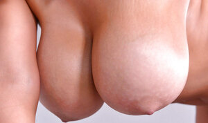 Madame's knockers spill out of dress so she makes her chicks hang while toying twat