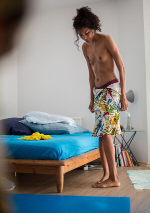 Tall Adriana E covers her slender body with a multicolor skirt and moreover top